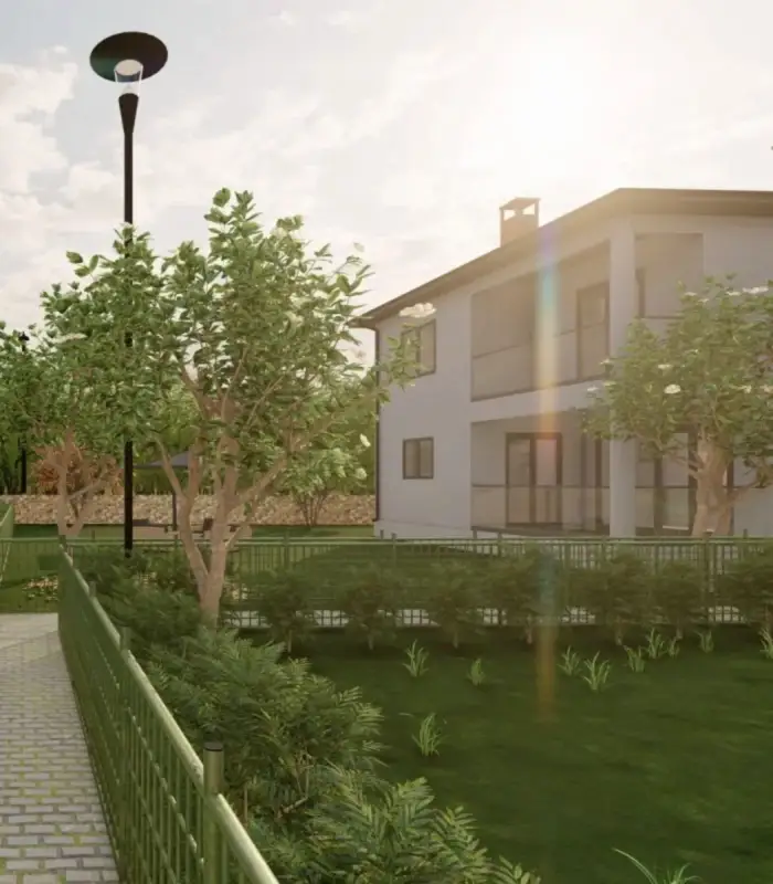 Dış Mekan Görselleştirme Hizmeti tarafından öne çıkarılan iki katlı bir villa, yeşil bitki örtüsü ve bakımlı bir çimenlik arasında beyaz bir dış cepheye sahiptir. Bir sokak lambası, güneş ışığı ağaçların arasından süzülürken, binaya giden asfalt yolu sıralar ve herhangi bir iç mimarın tasarım cazibesi için hayran kalacağı desenler oluşturur.